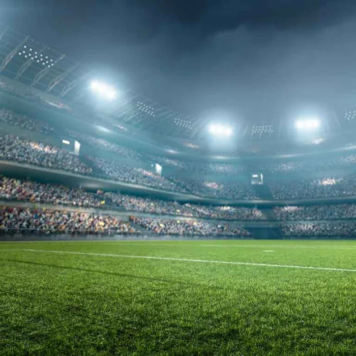 Estadio de futbol iluminado